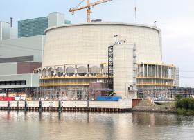 Plume-Abated Fan Assisted Natural Draft Cooling Tower