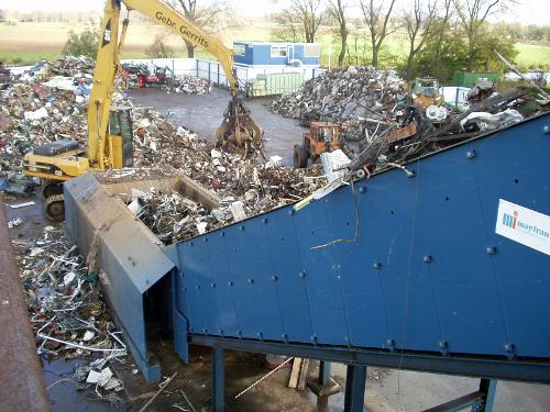 INFEED CONVEYORS FOR SCRAP AND SOLID WASTE SYSTEMS